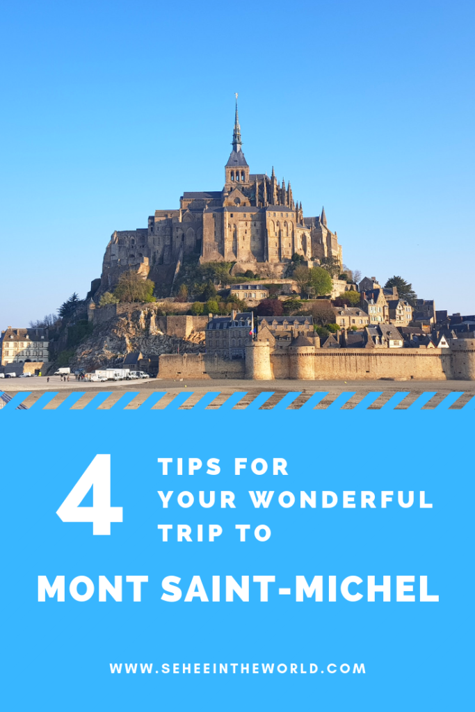 4 Tips for Wonderful Mont Saint Michel Trip for Pinterest Thumbnail, using the photo of Mont Saint Michel during the day